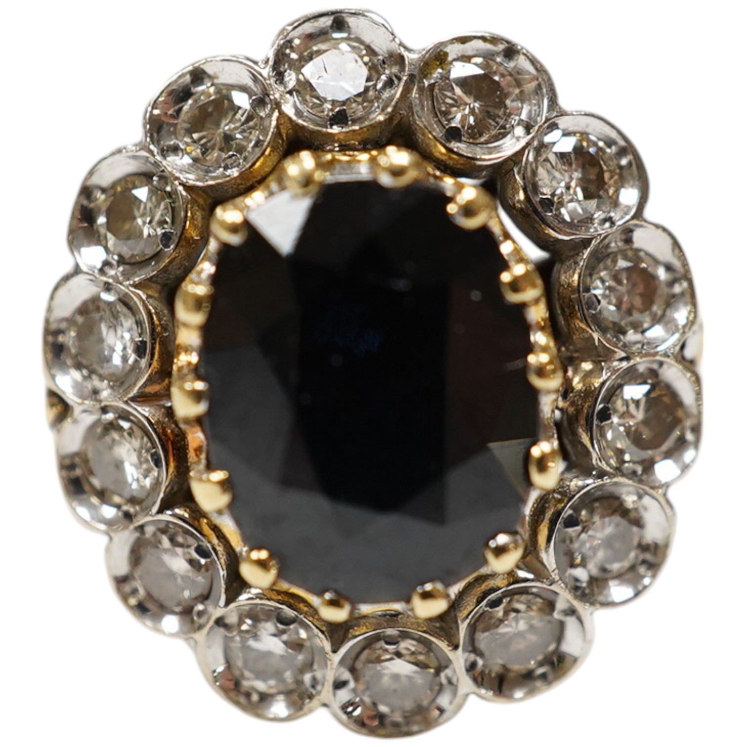 A modern 18ct gold, sapphire and diamond set oval cluster ring, size M, gross weight 5.3 grams. Condition - fair.